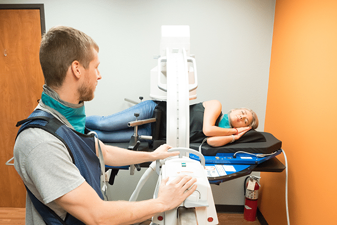 Lab Technician performing vertebral motion analysis